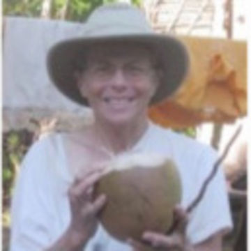 Catherine Craig holding a coconut