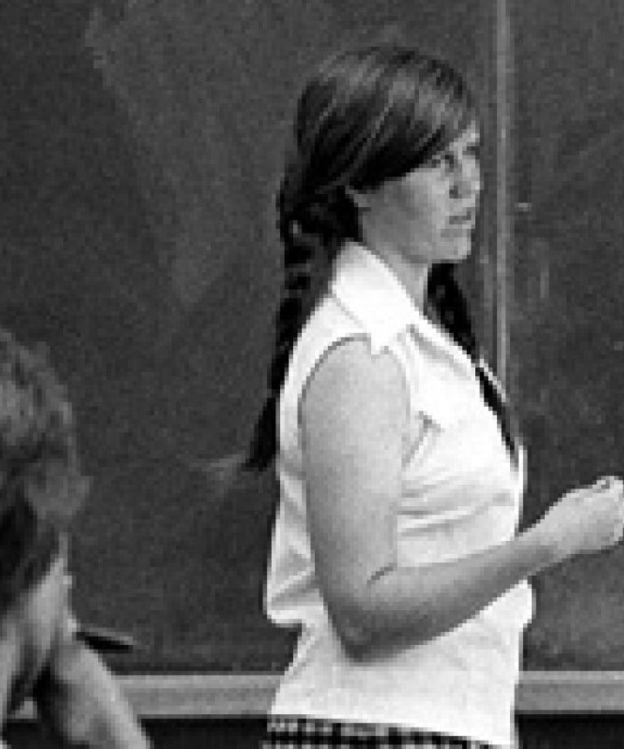 Teaching assistant in front of a chalkboard