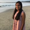 Shravya Gurrapu smiling on a beach